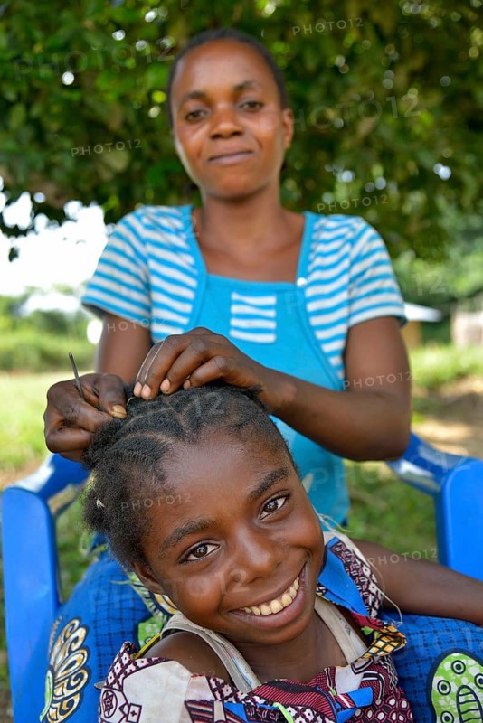 Mother doing her daughter's hair, Nkala, Bandundu Province, Democratic Republic of the Congo