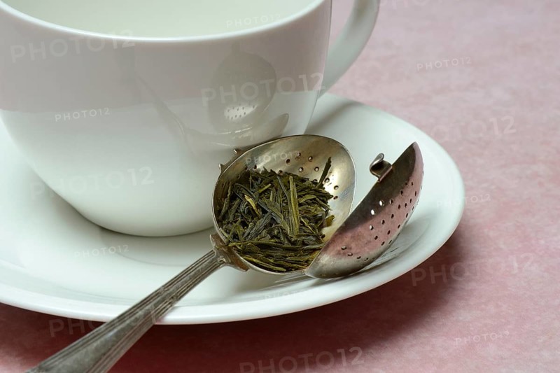 Tea leaves in tea strainer (Sencha) tea, green tea