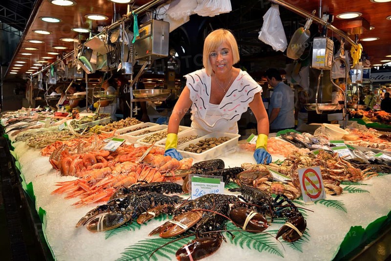 Fishmonger at her stall in the market hall, Mercat de la Boquería, also Mercat de Sant Josep, Barcelona, ??Catalonia, Spain, Europe