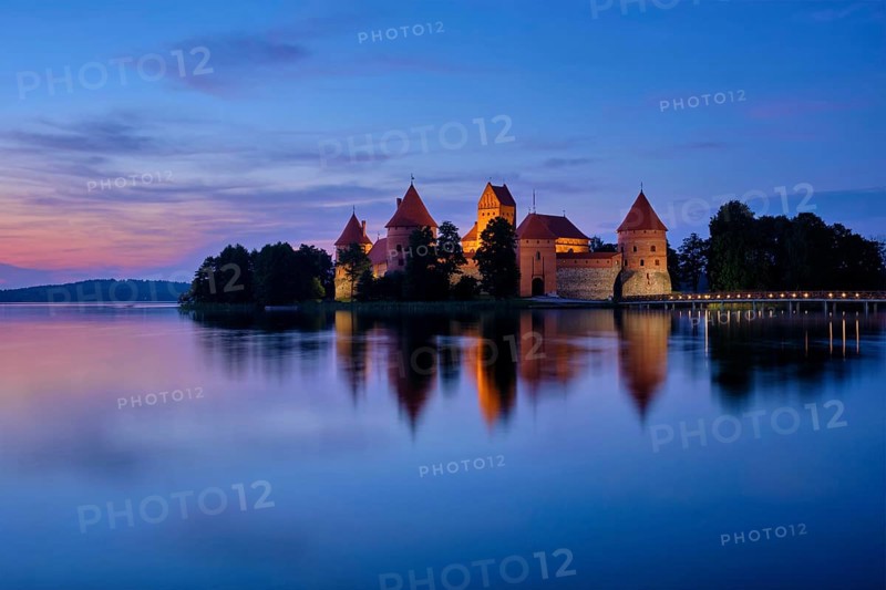 Trakai Island Castle in lake Galve illuminated in night, Lithuania, Europe