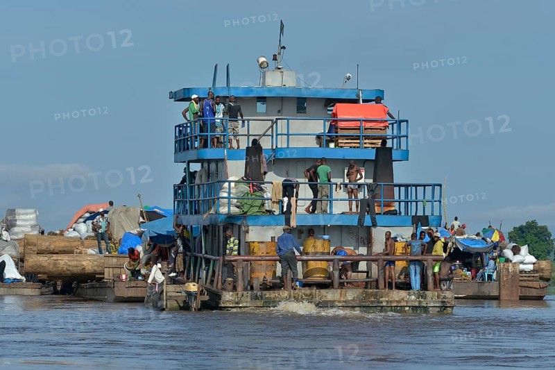 Freighter transporting logs of tropical timber on the Congo River, near Kinshasa, Kinshasa District, Democratic Republic of the Congo