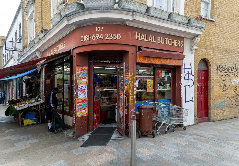 Halal butchers corner shop, Deptford High Street, London S8, England, UK