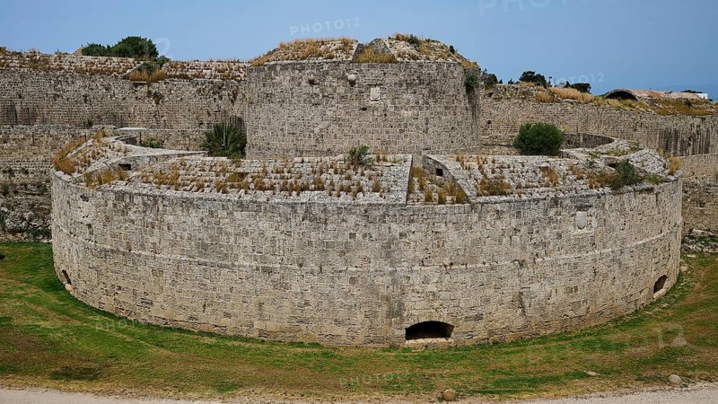 Fortress wall, Bastion del Carretto, A massive, round stone fortress rises on a green meadow, an imposing witness to times gone by, Rhodes Old Town, Rhodes Town, Rhodes, Dodecanese, Greek Islands, Greece, Europe
