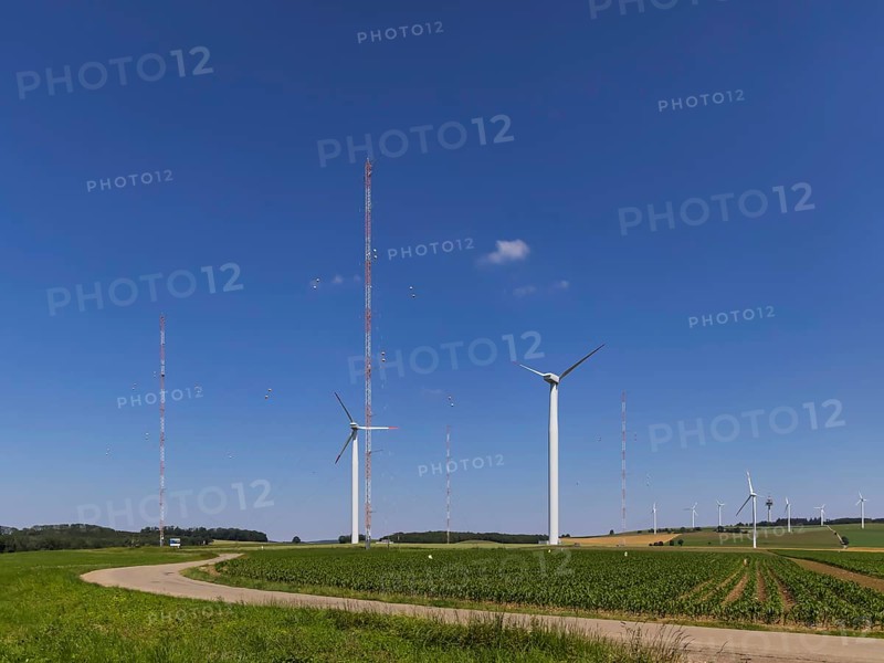 WINSENT test facility, research into wind power at high altitudes. In a research project, scientists in the Swabian Alb are investigating how wind turbines can be used efficiently under harsh conditions in mountainous regions. Two test wind turbines are fully equipped with measurement technology, flanked by four meteorological measuring masts. Geislingen an der Steige, Baden-Württemberg, Germany, Europe