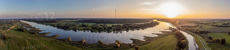 Panorama aerial view of river Elbe near Lenzen, marina Lenzen, view towards Höhbeck radio mast, sunset on calm summer evening, Germany, Europe