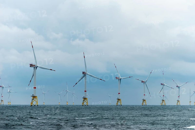 Offshore wind farm Nordsee Ost, operator RWE, north of Helgoland, German economic zone, wind turbines with jacket foundation structure, low swell, supply station, ship tug, Germany, Europe