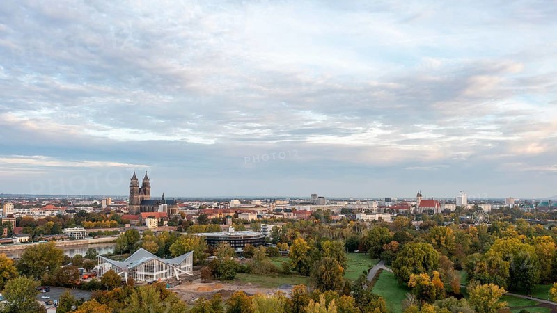Autumnal deciduous trees in the Rotehorn municipal park, behind them listed hypar shell, Magdeburg Cathedral, Our Lady's Convent, St. John's Church, Magdeburg, Saxony-Anhalt, Germany, Europe
