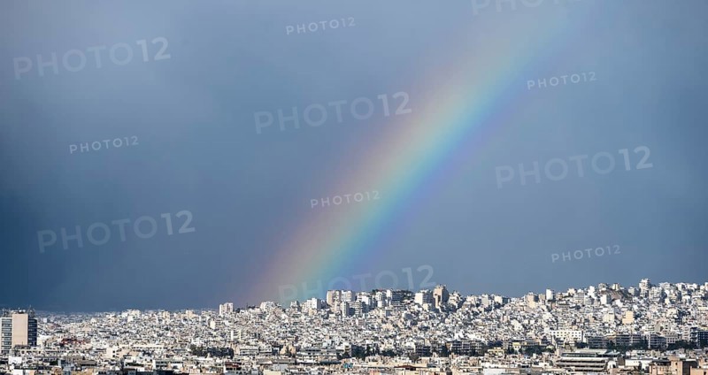 View over the sea of houses of Athens, with rainbow, Athens, Attica, Greece, Europe