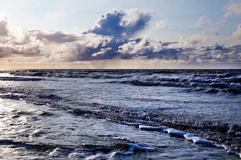 Outgoing tidal fringe in the mudflat landscape with dramatic clouds, North Sea, Norderney Island, East Frisia, Lower Saxony, Germany, Europe