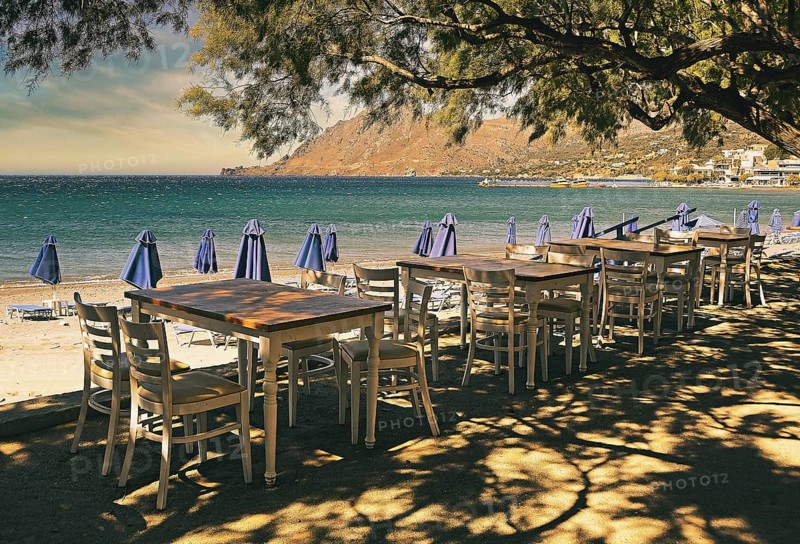 Gastronomy, tables and chairs on the beach, Plakias, Crete, Greece, Europe
