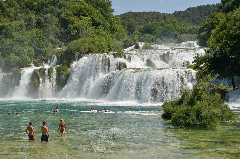 Tourists taking a bath at the Skradinski buk waterfalls, Krka National Park, Šibenik-Knin County, Dalmatia, Croatia, Europe