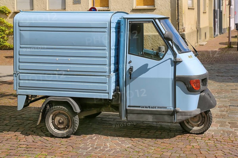 Motorised tricycle with loading area, Piaggio Ape 50, van, three-wheeled scooter, motor vehicle, means of transport, indicators, tyres, wheels, writing, letters, inscription, Demandt Zweiradtechnik, Balingen, Baden-Württemberg, Germany, Europe