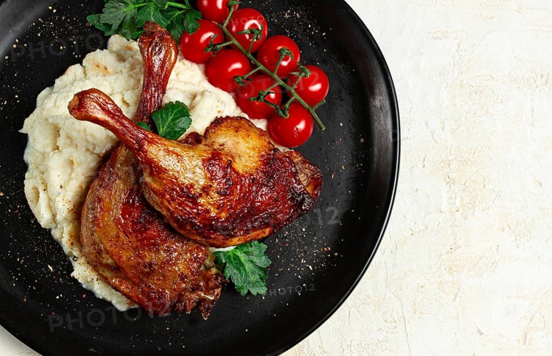 Fried duck shank, cauliflower puree, cherry tomatoes, homemade, no people