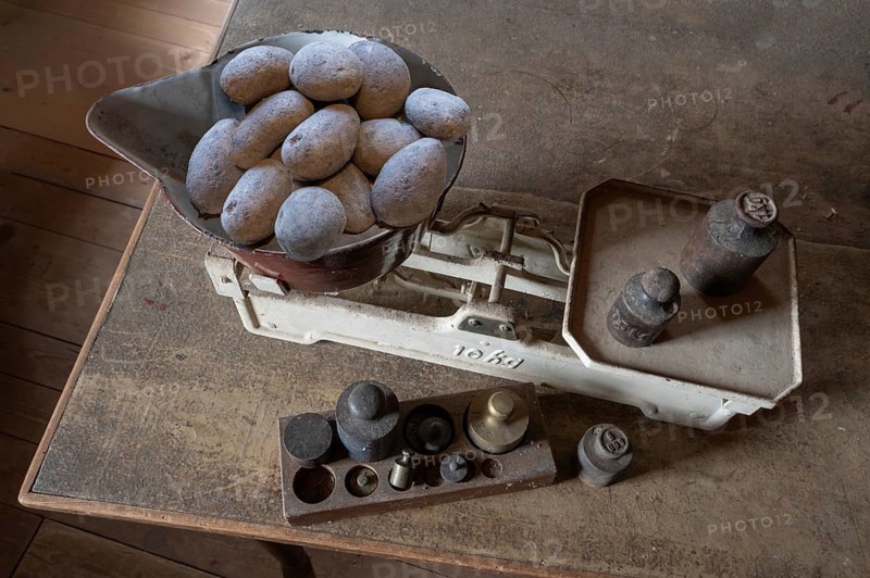 Old scales with weights in a former corn mill, Bavaria, Germany, Europe