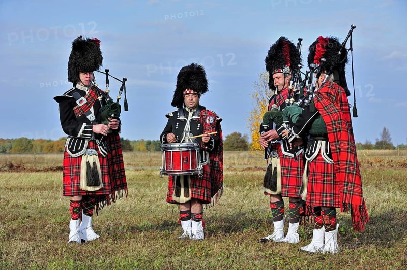 Scottish bagpipers playing pipes and drums, Scotland, UK