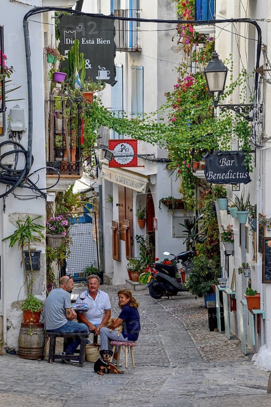 People in a sidewalk café in the old town of Peñíscola, Castellón province, Costa del Azahar, Valencia region, Spain, Europe