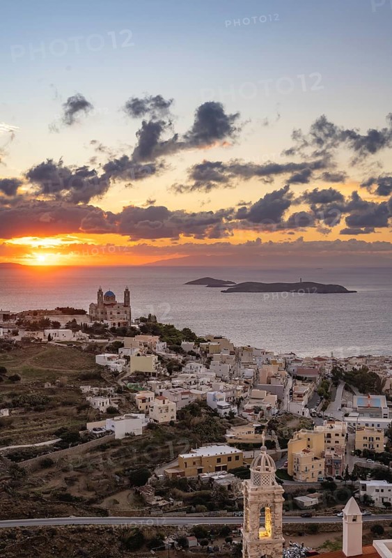 View from Ano Syros to the houses of Ermoupoli with the Anastasi Church or Church of the Resurrection, town view with islands and sea, dramatic cloudy sky at sunrise, Ano Syros, Syros, Cyclades, Greece, Europe