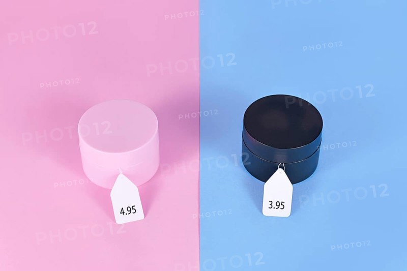 Pink tax concept showing pink and black facial cremes aimed at specific genders with different price tags