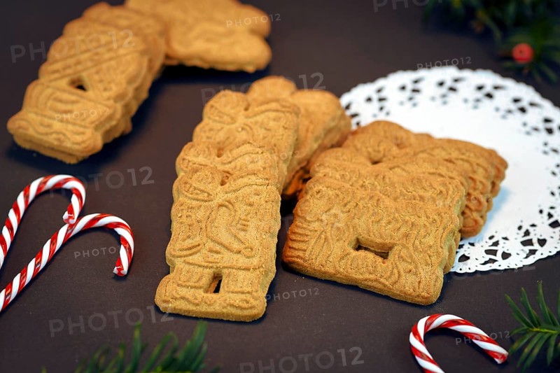 Speculaas or speculoos, a spiced thin, crunchy and caramelizedand shortcrust biscuit with figure stamped on the front side, traditionally baked in Europe in Christmas season