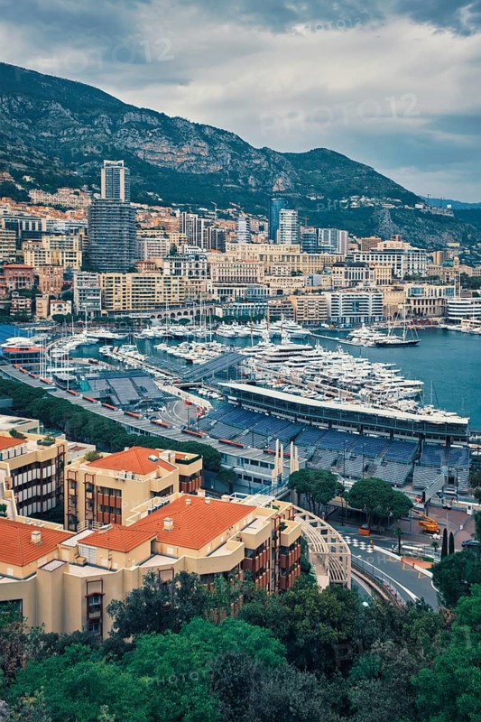 View of Monte Carlo, Monaco with race track street circuit and port with yachts and boats