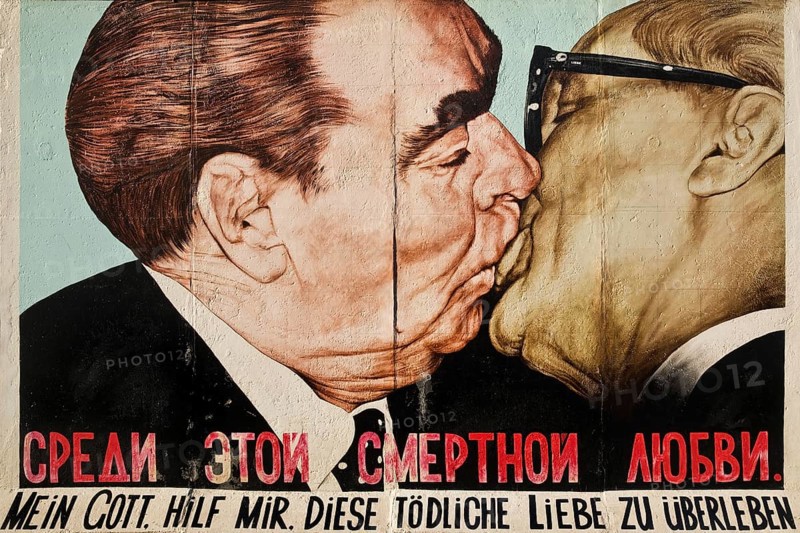 Brotherly Kiss, Brezhnev kisses Honecker, painting by Dmitri Vrubel on a remnant of the Berlin Wall, East Side Gallery, Berlin, Germany, Europe