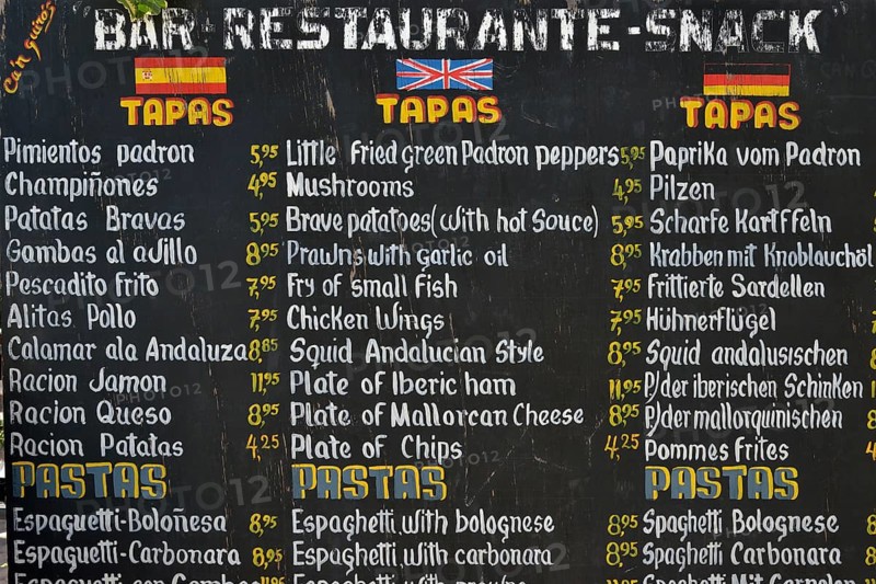Menu with tapas and pastas on offer in front of a restaurant, Puerto de Sóller, Majorca, Balearic Islands, Spain, Europe