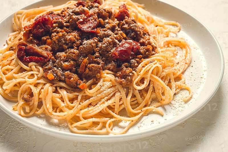 Spaghetti bolognese, with dried tomatoes, homemade, close-up