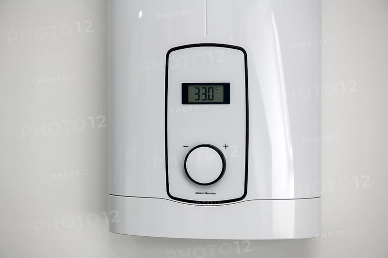 Instantaneous water heater for hot water Shower for showering Washbasin Bidet is set to low energy level 33 degrees Celsius for saving energy Electricity energy saving Electricity saving, Germany, Europe