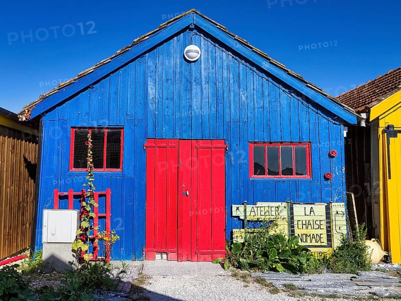 Colourful cottage, blue wooden façade, red door and windows, studio, Le Château-d'Oléron, Oleron Island, Charente Maritime Department, Nouvelle-Aquitaine, France, Europe