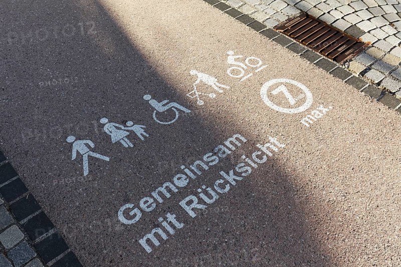 Mobility strip for walking speed in the pedestrian zone, marked with pictograms for pedestrians, cyclists and wheelchair users, together with consideration, Bad forest lake, Upper Swabia, Baden-Württemberg, Germany, Europe