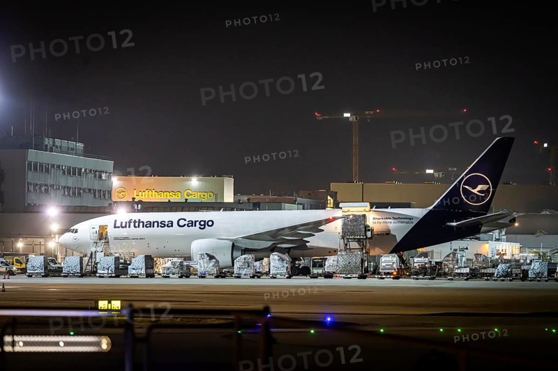 Lufthansa Cargo aircraft being loaded at the cargo centre, early in the morning at the airport in front of sunrise, Fraport, Frankfurt am Main, Hesse, Germany, Europe
