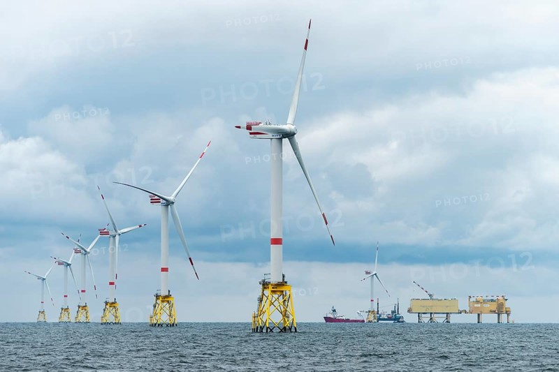 Offshore wind farm Nordsee Ost, operator RWE, north of Helgoland, German economic zone, wind turbines with jacket foundation structure, low swell, supply station, ship tug, Germany, Europe