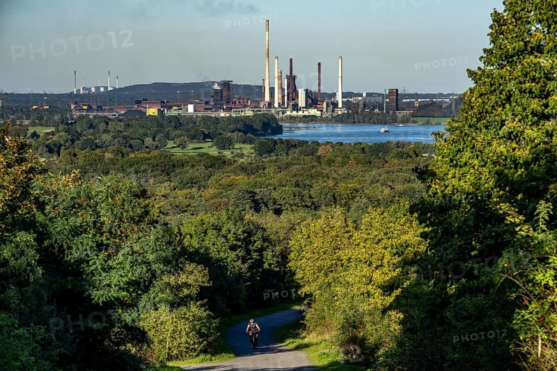 View, from the Rheinpreußen spoil tip in Mörs, across the Rhine to the Thyssenkrupp Steel steelworks in Duisburg-Beeckerwerth, blast furnaces, coking plant, green landscape on the left bank of the Rhine, North Rhine-Westphalia, Germany, Europe