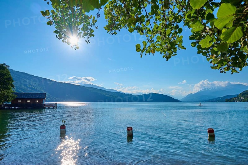 Lake, boathouse, sun, standup paddler, evening, summer, Lake Millstatt, Döbriach, Carinthia, Austria, Europe