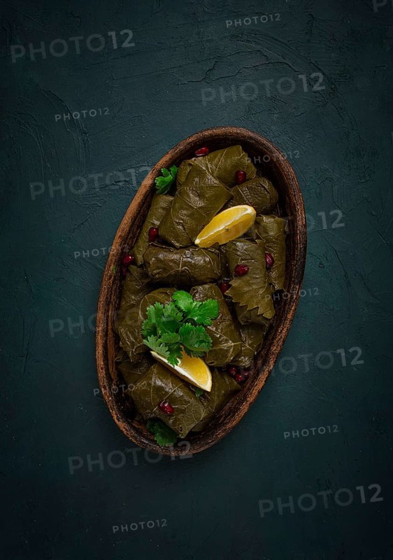 Dolma (Tolma) stuffed rolls, minced meat with rice, in grape leaves, top view, no people, close-up