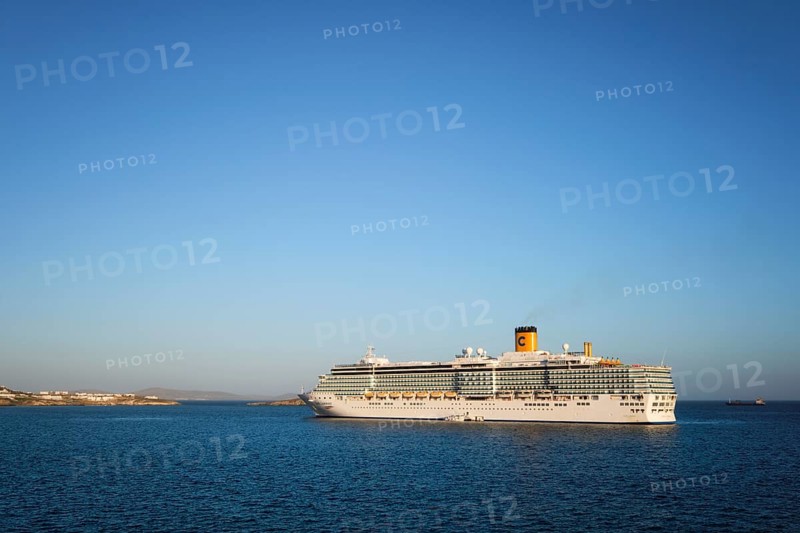 MYKONOS, GREECE, MAY 29, 2019: Cruise liner ship Costa Luminosa in Mediterranea sea near Mykonos island. Aegean sea, Greece, Europe