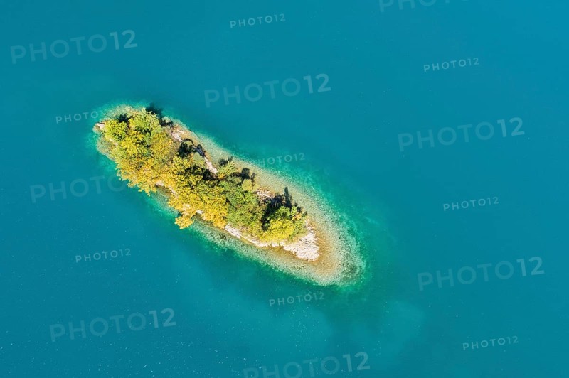 Bird's eye view of the chive island in the turquoise waters of Lake Walen in the canton of St. Gallen, Switzerland, Europe