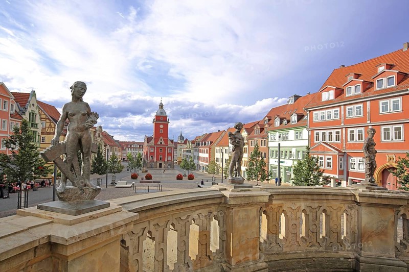 Three sculptures Prudentia, Caritas and Fortitudo by Bernd Göbel 2021 on balustrade with blurred Old Town Hall, historical, historical, depth of field, blur, parapet, wisdom, prudence, love, courage, valour, allegory, Greek mythology, virtues, virtue, horse trough, main market, Gotha, Thuringia, Germany, Europe