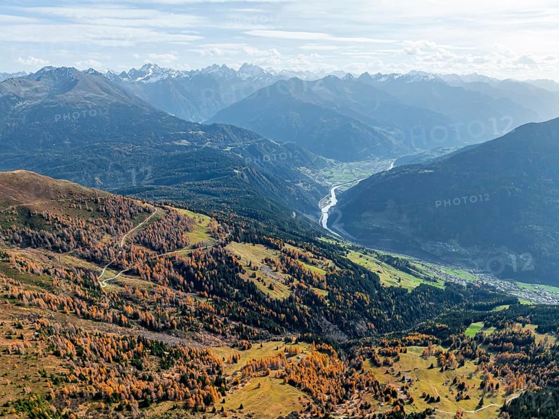 View of the mountain panorama and the Upper Inn Valley in the morning light, Krahberg on the Venet in autumn with yellow larches, Ötztal Alps, Tyrol, Austria, Europe