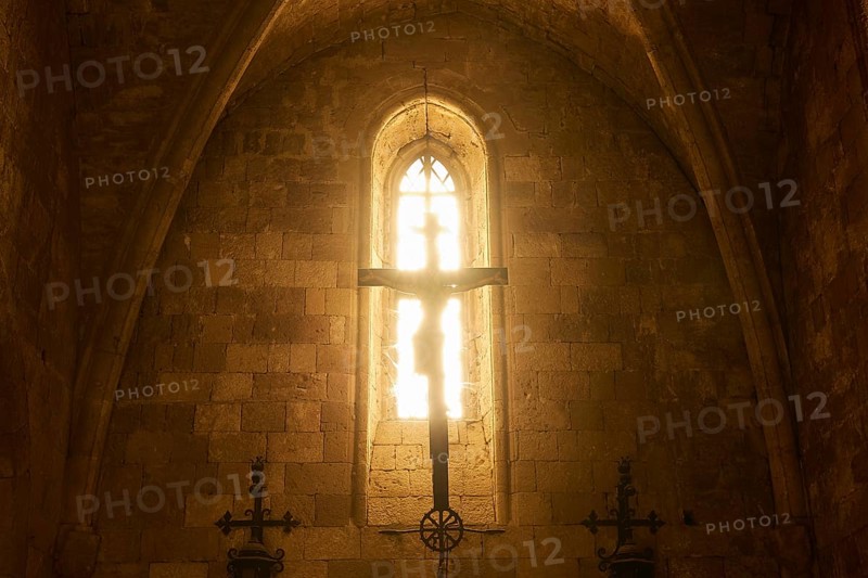 Chancel of the monastery church, window of a church with sunlight on a cross, Gothic style, Monastery of Our Lady of Mount Filerimos, Filerimos, hill not far from Rhodes town, Ancient State of Ialyssos, Rhodes, Dodecanese, Greek Islands, Greece, Europe