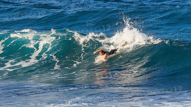 Surfer riding a big wave in the blue sea, wave surfer, surfer, surf, waves, west coast, Arkasa, Karpathos, Dodecanese, Greek Islands, Greece, Europe
