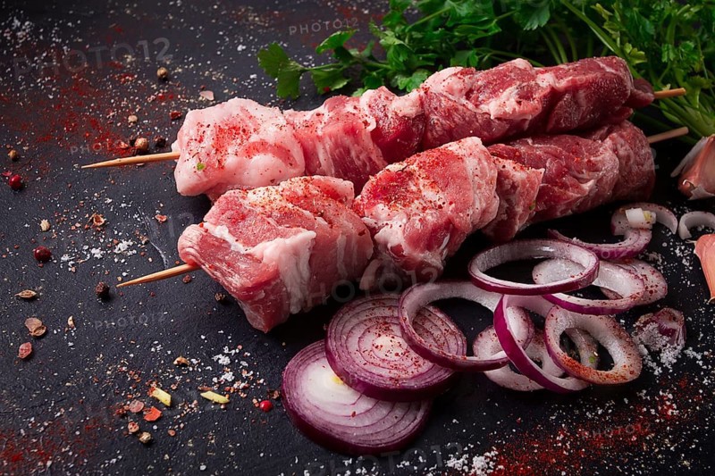 Raw pork meat, pickled kebab, with spices, top view, no people