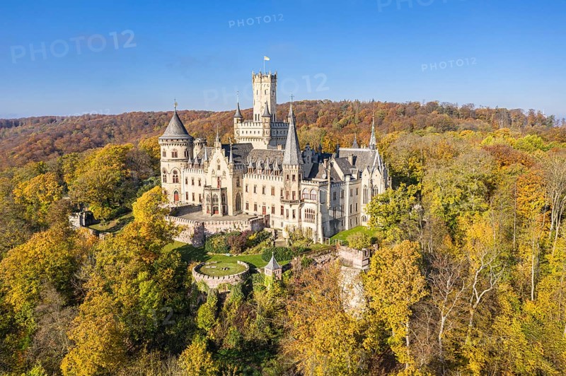Drone shot of Castle Marienburg south from Hannover, on Mt Marienberg above river Leine, autumnal foliage, Germany, Europe
