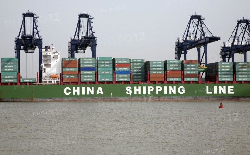 Cranes unloading containers China Shipping Line container ship, Port of Felixstowe, Suffolk, England, UK