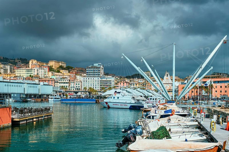Genoa, Italy, April 26, 2019: Port of Genoa (Genova) Old Port Porto Antico with yachts and boats with stormy sky. Genoa, Italy, Europe