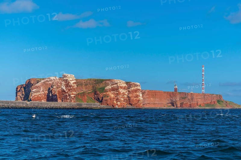 Red red sandstone cliff edge, Heligoland high sea island, North Sea, lighthouse, radio tower, blue sky, Pinneberg district, Schleswig-Holstein, Germany, Europe
