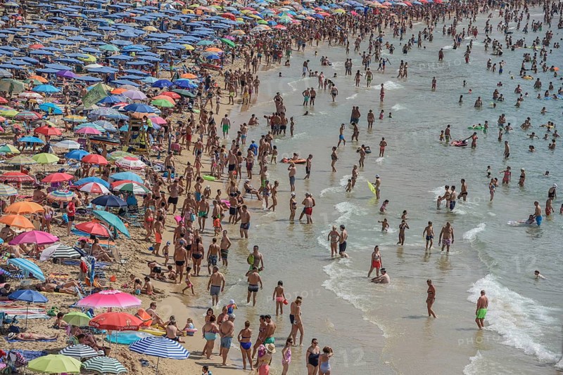 Tourists at Playa de Levante, Benidorm, Alicante, Costa Blanca, Spain, Europe