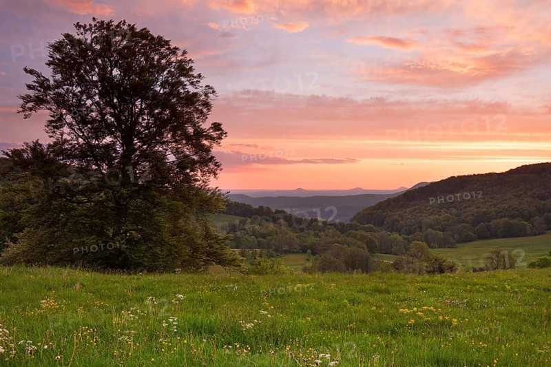 Randecker Maar on the Swabian Alb. Beautiful sunrise with the Drei Kaiser mountains in the distance