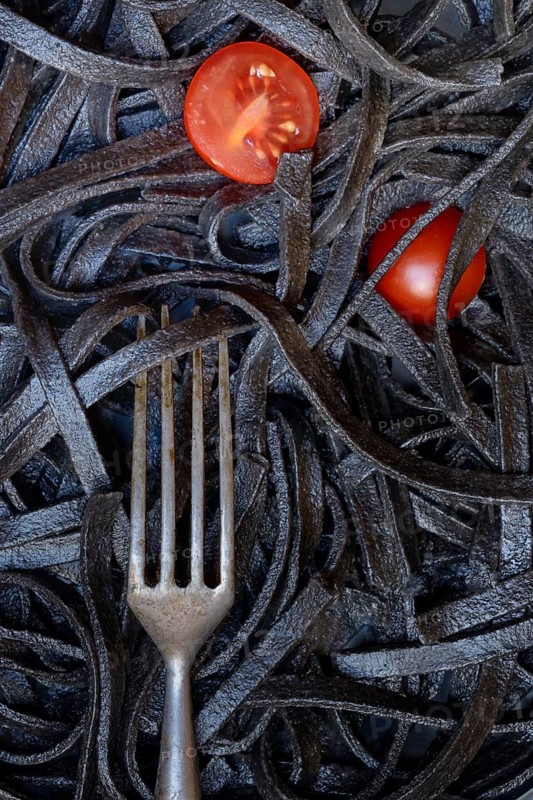 Black pasta coloured with squid ink and fork, Taglioni al Nero di Seppia, Italy, Europe
