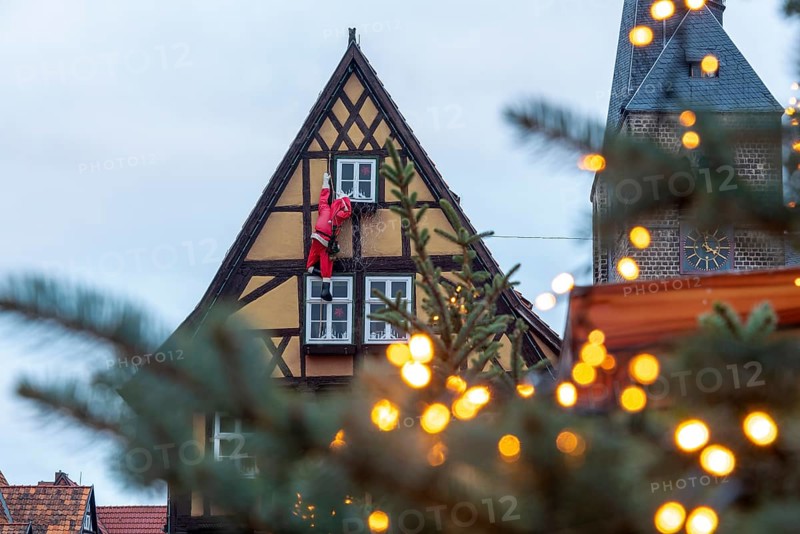 Historic half-timbered house with Father Christmas, Christmas lights, Quedlinburg, Saxony-Anhalt, Germany, Europe